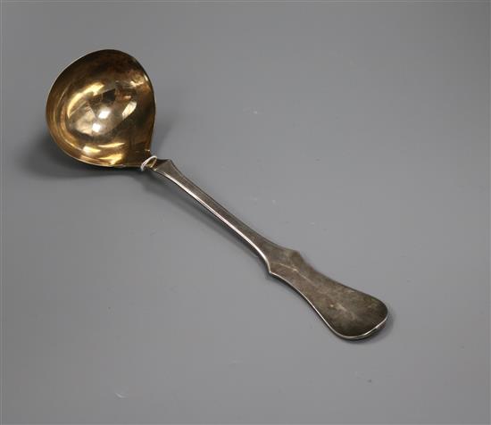 A German 800 white metal soup ladle.